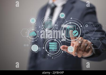 Concept of ERP and document management using icons on a virtual screen Stock Photo