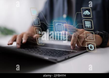 Businessperson use a computer to document management, online documentation database, and digital file storage system software, records management, dat Stock Photo