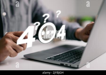 A guy checks an error 404, page not found, online service notice message on a website using a magnifying glass and question marks. Stock Photo