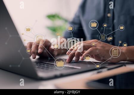 Document Management System, or DMS for short. A laptop is being used by an IT consultant. Theoretical Model of the Internet. Information file manageme Stock Photo