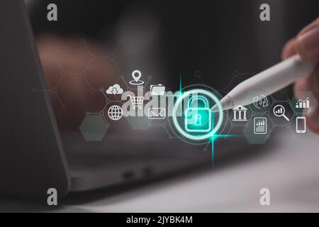 Data security and privacy ideas. Internet network security and the lock icon. A businessman protects personal data on virtual screens. Stock Photo
