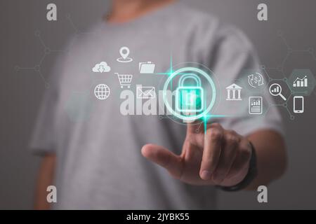 Cybersecurity and privacy concepts to protect data. Lock icon and internet network security technology. A businessman uses virtual screen interfaces t Stock Photo