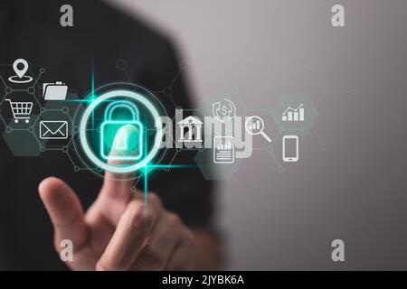 Cybersecurity and privacy ideas are used to safeguard data. The lock icon and internet network security technologies. A businessman uses virtual scree Stock Photo
