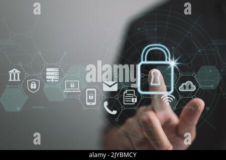 Data security and privacy. A network of cybersecurity. Individuals private information is protected by this businessman. A padlock symbol and a connec Stock Photo