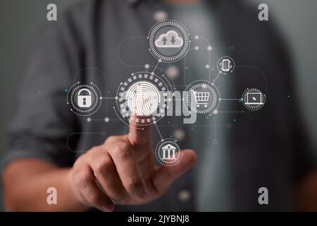 The businessman's fingerprint scan offers secure interface for online payments, banking, and cloud computing network connections. Stock Photo