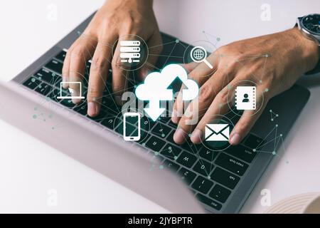 A individual utilizing a laptop computer is using cloud computing. Stock Photo