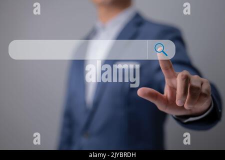 Search Engine Optimization using Data Search Technology. A man's hands are searching for information. Using Search engine Console to help you with you Stock Photo
