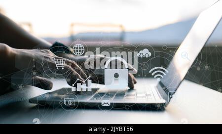 The concept of business, technology, the internet, and networking. On the virtual screen, a businessman working on his laptop at home selects the secu Stock Photo