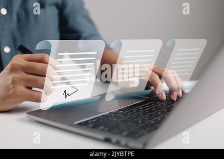 Agreement. Contracts were signed. Businessman using laptop with E-document icons, paperless office concept. Stock Photo