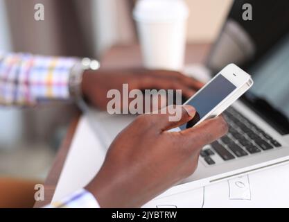 Cropped view of professional male UX web designer working on his new smartphone templates project while using blank screen tablet Stock Photo