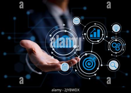 A person utilizing Cloud Computing Technology. Concept of an Internet Storage Network and a massive database of big data using internet technologies. Stock Photo