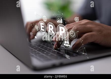 An IT manager looks at the architecture of ERP (Enterprise Resource Planning) ERP, enterprise resource planning, concept of productivity and improveme Stock Photo