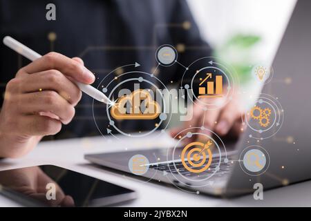 Cloud computing technology is used by this man. Internet storage network concept and a big database with a lot of data through the internet. Stock Photo