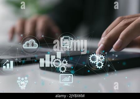 Businessman touch on smartphone. Concept of business automation software technology process system Stock Photo