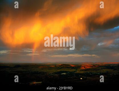 Storm Clouds at Sunset over the Ore Mining Town of Tom Price, Pilbara,  Northwest Australia Stock Photo