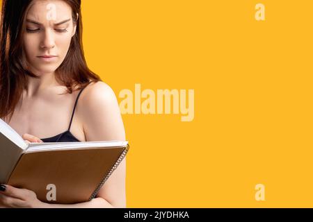 making notes thoughtful woman writing notebook Stock Photo