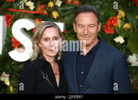 Emma Hewitt and Jason Isaacs attends the 'Ticket To Paradise' World Premiere at Odeon Luxe Leicester Square in London, England. Stock Photo