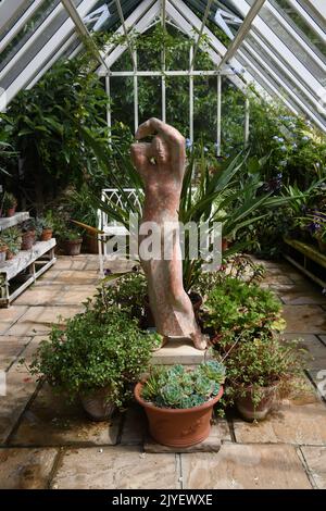 Greenhouse with terracotta statue Stock Photo
