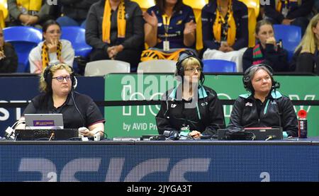 Officials are seen on the bench during the Round 11 Super Netball match ...