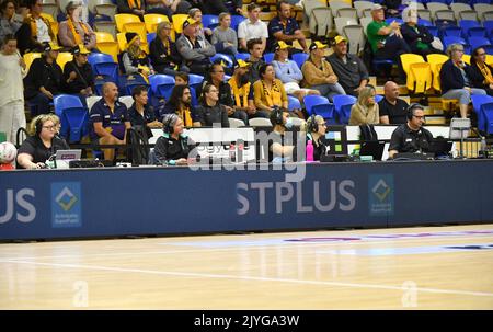 Officials are seen on the bench during the Round 11 Super Netball match ...