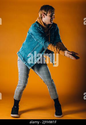 Muscular dance performer practicing dance moves at the studio Stock Photo