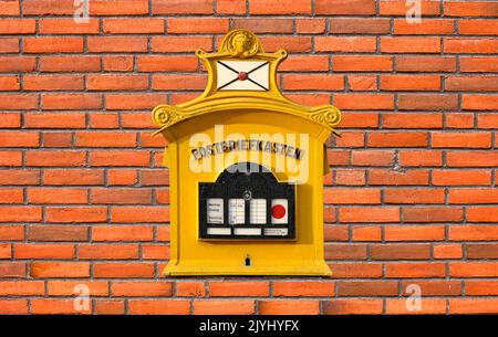 Old letter box on an old red brick wall, Germany, Stuttgart Stock Photo