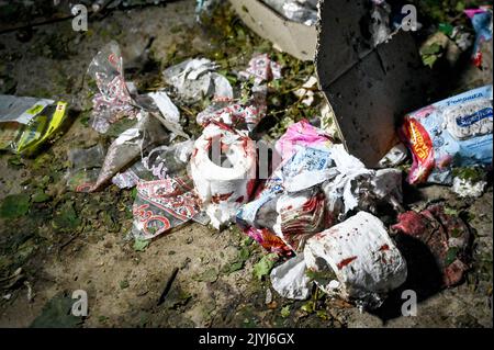 MALA TOKMACHKA, UKRAINE - SEPTEMBER 7, 2022 - Blood covers the remains of humanitarian cargo after the shelling of Russian troops, Mala Tokmachka vill Stock Photo