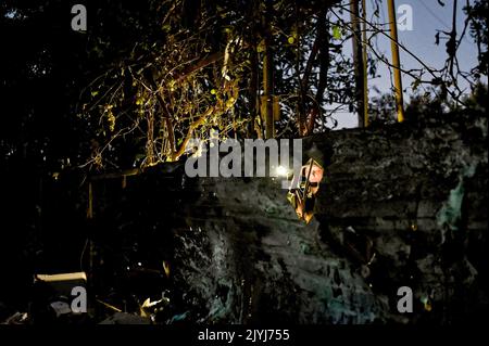 MALA TOKMACHKA, UKRAINE - SEPTEMBER 7, 2022 - Journalists take pictures of shrapnel holes after the shelling of Russian troops, Mala Tokmachka village Stock Photo