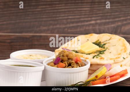 Chole Kulche Also Called Matar Kulcha, Chhole Kulche Is Widely Popular Delhi Street Food. The Dish Comprises Of Mildly Leavened Soft Fluffy Flatbread Stock Photo