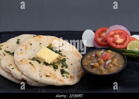 Chole Kulche Also Called Matar Kulcha, Chhole Kulche Is Widely Popular Delhi Street Food. The Dish Comprises Of Mildly Leavened Soft Fluffy Flatbread Stock Photo