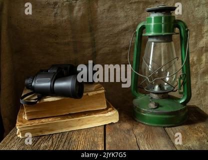 Old objects on a wooden table. Still life of old things on the background of burlap Stock Photo