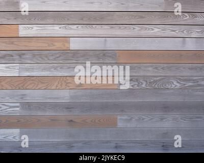 Gray wooden plank floor horizontal texture. Floor from gray and red terrace boards. Not seamless texture. Stock Photo