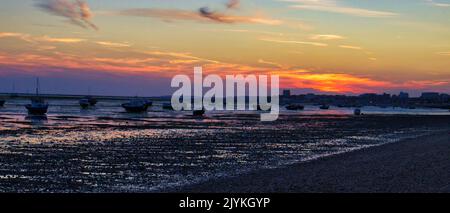 Sunset at Shoebury common beach looking towards Southend on sea pier Stock Photo