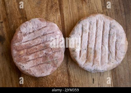 frozen assorted hamburgers of white and red meat Stock Photo