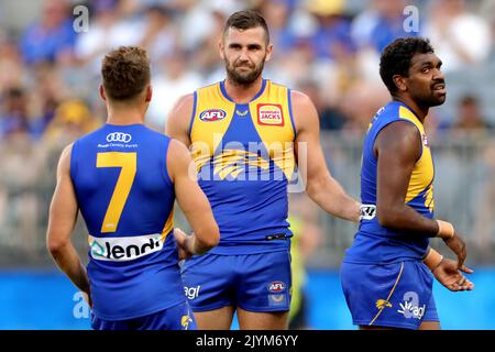 Jack Darling centre of the Eagles is congratulated by teammates