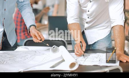 two designers in the office are working on a new project Stock Photo