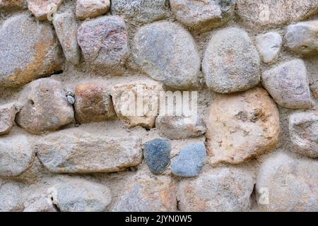 Natural stone wall. Abstract stone texture. Closeup. Stock Photo