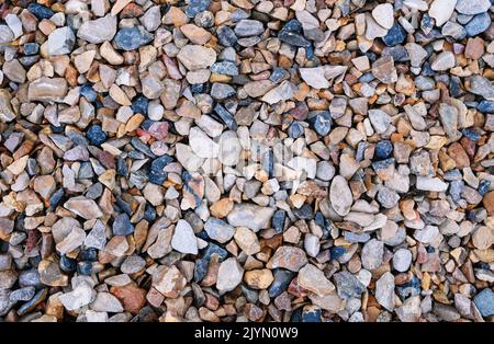 Texture of natural rubble. Stones, crushed stone building material. Top view. Stock Photo