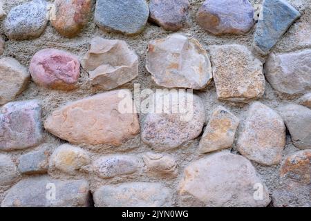Natural stone wall. Abstract stone texture. Closeup. Stock Photo