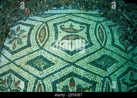 A small portion of the new mosaic: the geometric design is probably formed by a sequence of hexagons with a pair of facing peltas in the center, rendered with colored tiles. It has been discovered at the end of 2019. It?s situated in the thermal complex of Lacus Baianus, Marine Protected Area of Baia, Naples, Italy, Tyrrhenian Sea Stock Photo