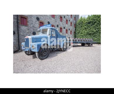 Old delivery truck laden with whiskey barrels on display outside the Jamesons Old Distillery.County Cork, Republic of Ireland. Stock Photo