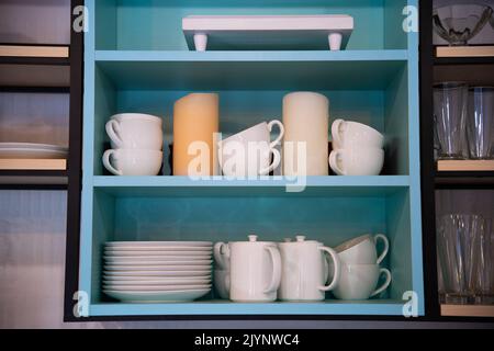 kitchen utensils on the shelf in the closet Stock Photo
