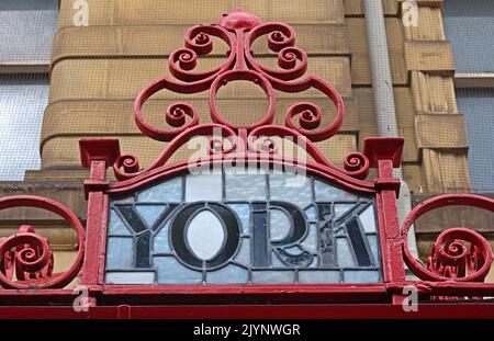York Art Nouveau Red lettering showing M&LR and L&YR destinations on ornate glass and iron station canopy at Manchester Victoria railway station. Stock Photo