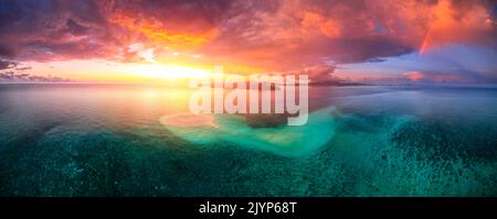 First sunset of the year 2022, a beautiful sunset that occurs just after the passage of storm squalls on the white sand islet of Saziley, Mayotte Stock Photo