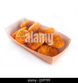 Delicious ready to eat nugget deep fried snack on white background isolated snacks appetizers concept in cardboard delivery box Stock Photo