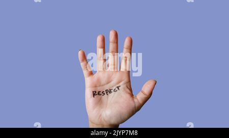 Word resprct written on hand isolated on blue background Stock Photo