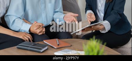 Family couple consultations with a lawyer or insurance agent. Law and insurance Stock Photo