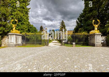 The baroque entrance to the Wenkenpark in Riehen guarded by two gilded deer modeled after the French sculptor Jean Goujon (XVI century), Basel-Stadt c Stock Photo