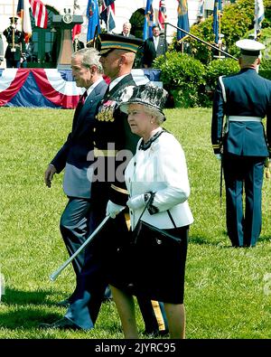 Washington, DC - May 7, 2007 -- United States President George W. Bush and Her Majesty Queen Elizabeth II of Great Britain review the troops during an Arrival Ceremony on the South Lawn of the White House in Washington, DC on Monday, May 7, 2007. Credit: Ron Sachs/CNP Stock Photo