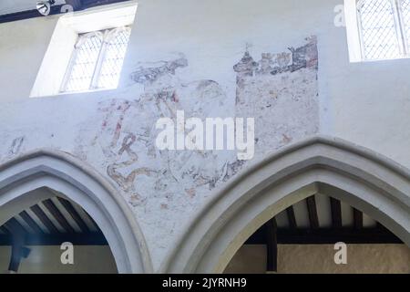 Some of the most important medieval wall murals can be found in St Andrews Church in Nether Wallop Hampshire. Stock Photo